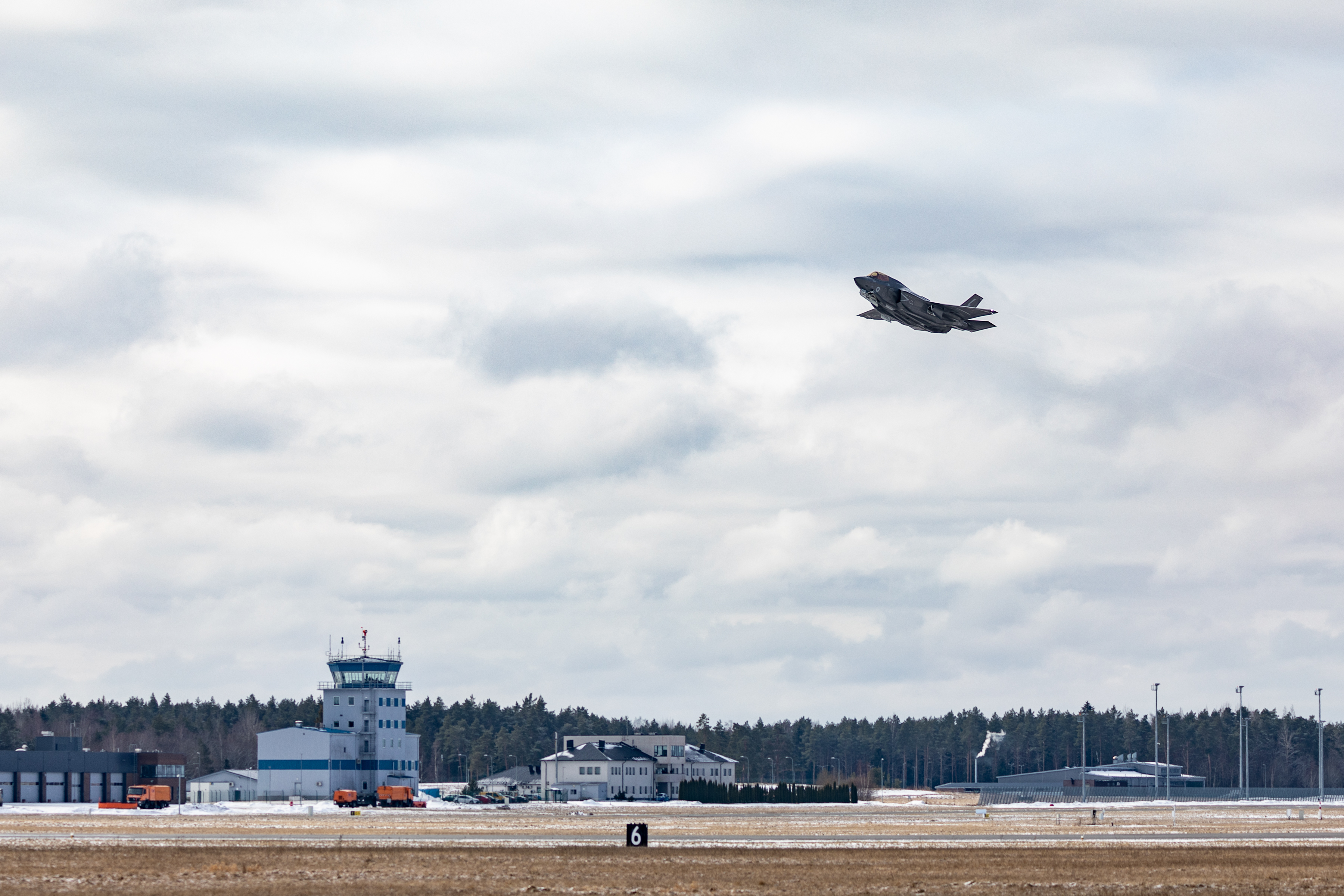 Lightning aircraft taking off from airfield.